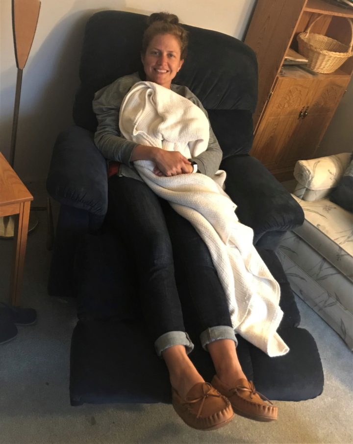 woman on recliner with blanket